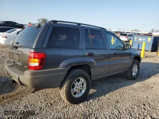 2002 Jeep Grand Cherokee Laredo with VIN 1J4GW48N32C180185, listed as a Copart auction lot 51988335 with 212,399 mi miles and Salvage Title. Bid and sale history available at carsss.com. Image 4.