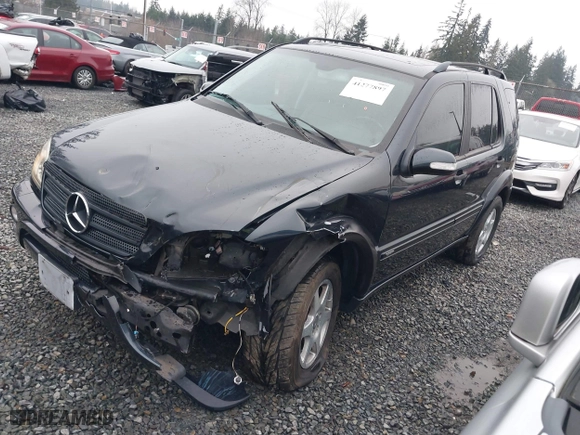 2002 Mercedes-Benz M-Class with VIN 4JGAB54E72A296354, listed as a IAAI auction lot 41277897 with 101,842 mi miles. Bid and sale history available at carsss.com. Image 2.