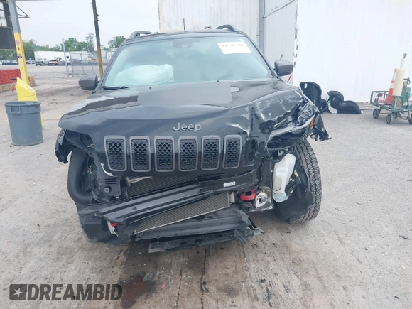 2021 Jeep Cherokee Trailhawk with VIN 1C4PJMBX0MD167941, listed as a IAAI auction lot 42507379 with 70,414 mi miles and . Bid and sale history available at DreamBid. Image 6.
