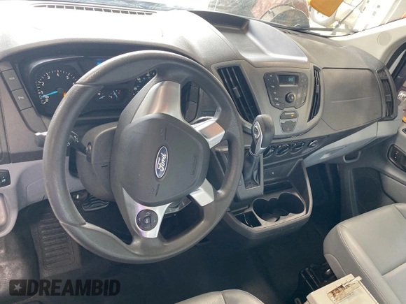 2016 Ford Transit Cargo z VIN 1FTYE1YM3GKB18575, wystawiony jako IAAI lot #42734024 z przebiegiem 186 138 mil mil oraz . Historia ofert i sprzedaży dostępna na DreamBid. Obrazek 2.