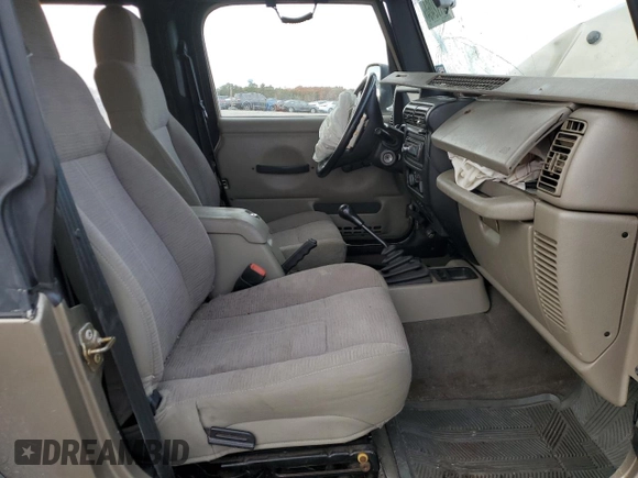 2003 Jeep Wrangler SE with VIN 1J4FA29183P324978, listed as a Copart auction lot 79172464 with Not provided miles and Salvage title. Bid and sale history available at DreamBid. Image 7.