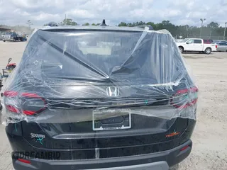 2025 Honda Pilot TrailSport with VIN 5FNYG1H61SB026477, listed as a IAAI auction lot 41471719 with 12,624 mi miles and . Bid and sale history available at DreamBid. Image 6.