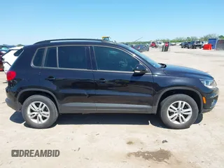 2015 Volkswagen Tiguan SE with VIN WVGAV7AX1FW558855, listed as a IAAI auction lot 42064427 with 58,584 mi miles and . Bid and sale history available at DreamBid. Image 13.