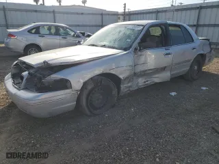 2000 Ford Crown Victoria with VIN 2FAFP73W5YX181565, listed as a Copart auction lot 77098594 with 180,439 mi miles and Salvage Title. Bid and sale history available at carsss.com. Image 1.