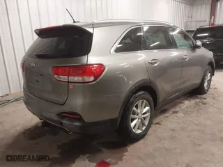 2017 Kia Sorento LX V6 with VIN 5XYPGDA55HG217691, listed as a IAAI auction lot 42083111 with 124,444 mi miles. Bid and sale history available at carsss.com. Image 4.