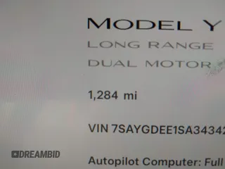 2025 Tesla Model Y Long Range with VIN 7SAYGDEE1SA343429, listed as a IAAI auction lot 41504455 with 1,284 mi miles and . Bid and sale history available at carsss.com. Image 15.
