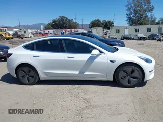 2019 Tesla Model 3 Mid Range with VIN 5YJ3E1EA1KF422983, listed as a IAAI auction lot 41861334 with 53,017 mi miles. Bid and sale history available at carsss.com. Image 13.