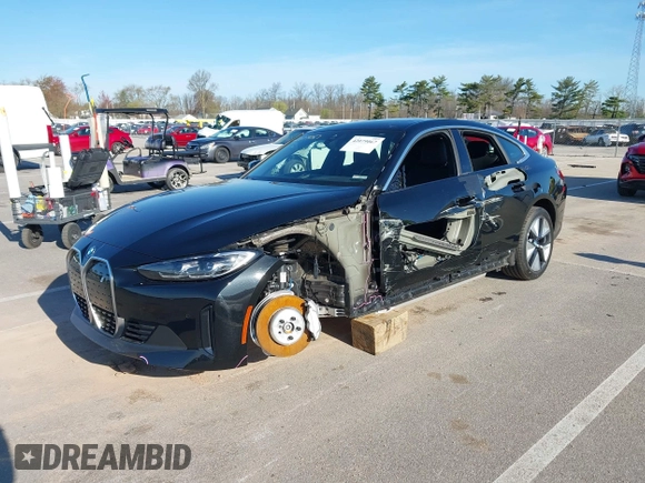 2024 BMW i4 xDrive40 z VIN WBY83FB05RFS69775, wystawiony jako IAAI lot #42079067 z przebiegiem 4 607 mil mil oraz . Historia ofert i sprzedaży dostępna na DreamBid. Obrazek 19.