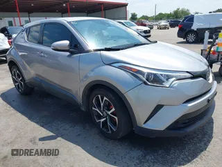 2018 Toyota C-HR XLE z VIN NMTKHMBX9JR034597, wystawiony jako IAAI lot #41995412 z przebiegiem 126 263 mil mil oraz . Historia ofert i sprzedaży dostępna na DreamBid. Obrazek 1.