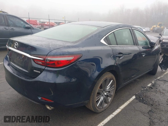 2021 Mazda 6 Touring with VIN JM1GL1VM4M1616243, listed as a IAAI auction lot 41907100 with 59,315 mi miles and . Bid and sale history available at carsss.com. Image 4.