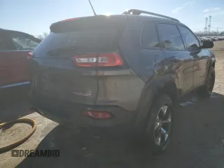 2014 Jeep Cherokee Trailhawk with VIN 1C4PJMBS1EW161642, listed as a Copart auction lot 46672345 with 196,908 mi miles and Salvage Title. Bid and sale history available at carsss.com. Image 3.