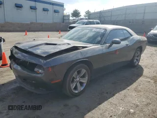 2015 Dodge Challenger SXT with VIN 2C3CDZAGXFH860823, listed as a Copart auction lot 61626855 with 104,152 mi miles and Salvage title. Bid and sale history available at DreamBid. Image 1.