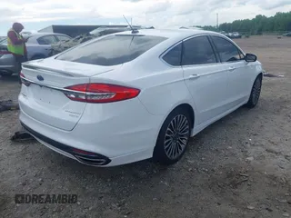 2017 Ford Fusion Titanium z VIN 3FA6P0K93HR203063, wystawiony jako IAAI lot #42243064 z przebiegiem 176 078 mil mil oraz . Historia ofert i sprzedaży dostępna na DreamBid. Obrazek 4.