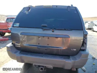 1999 Jeep Grand Cherokee Laredo with VIN 1J4GW58N9XC633464, listed as a Copart auction lot 84682454 with 212,738 mi miles and Salvage Title. Bid and sale history available at carsss.com. Image 6.