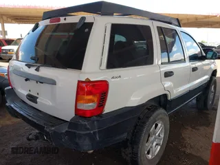 2000 Jeep Grand Cherokee Laredo z VIN 1J4GW48S4YC299149, wystawiony jako IAAI lot #42347792 z przebiegiem 229 007 mil mil oraz . Historia ofert i sprzedaży dostępna na DreamBid. Obrazek 4.