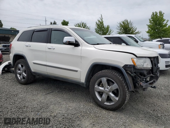 2011 Jeep Grand Cherokee Overland with VIN 1J4RR6GT9BC696319, listed as a Copart auction lot 56914185 with 211,661 mi miles and Salvage title. Bid and sale history available at DreamBid. Image 4.