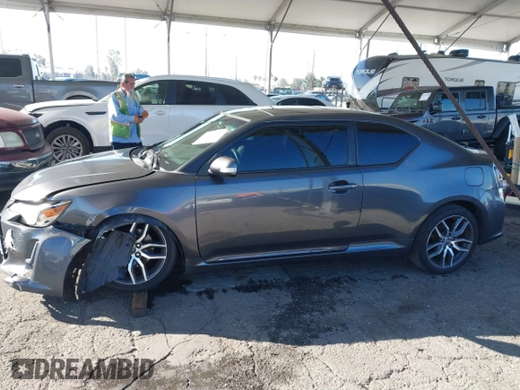 2016 Scion tC with VIN JTKJF5C78GJ014184, listed as a IAAI auction lot 41622575 with 128,520 mi miles. Bid and sale history available at carsss.com. Image 14.