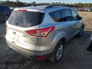 2014 Ford Escape SE with VIN 1FMCU9G96EUC53975, listed as a IAAI auction lot 41342661 with 128,594 mi miles. Bid and sale history available at carsss.com. Image 4.