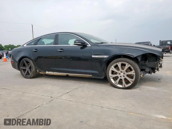 2015 Jaguar XJ with VIN SAJWA1CZ8F8V85381, listed as a Copart auction lot 57464225 with 161,938 mi miles and Salvage Title. Bid and sale history available at DreamBid. Image 4.