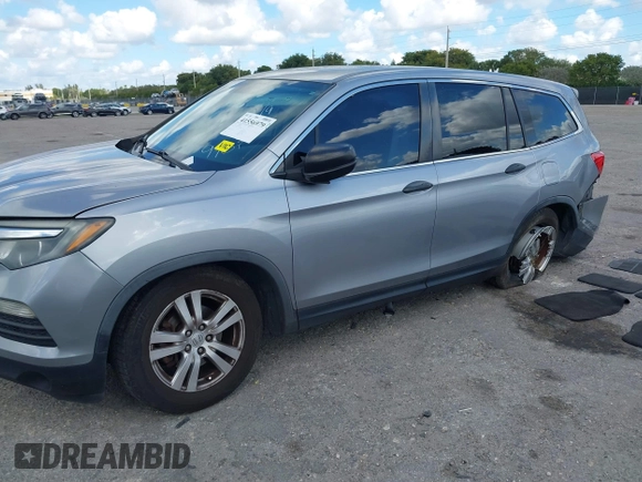 2016 Honda Pilot LX with VIN 5FNYF6H1XGB099987, listed as a IAAI auction lot 41556979 with 98,373 mi miles. Bid and sale history available at carsss.com. Image 2.