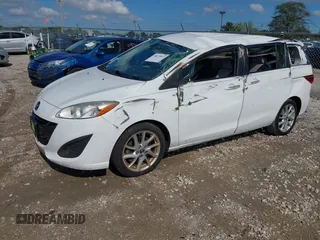 2013 Mazda 5 Touring with VIN JM1CW2CLXD0151396, listed as a IAAI auction lot 40479013 with 118,314 mi miles and . Bid and sale history available at DreamBid. Image 2.