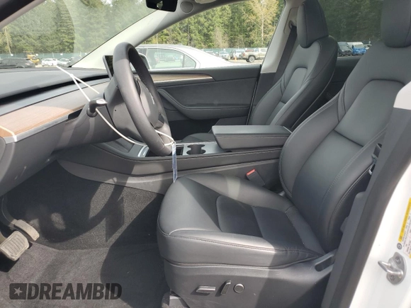 2023 Tesla Model Y Long Range with VIN 7SAYGDEE6PA101291, listed as a Copart auction lot 52758115 with 7,250 mi miles and Salvage Title. Bid and sale history available at DreamBid. Image 7.