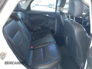 2015 Ford Focus Titanium with VIN 1FADP3J28FL256155, listed as a IAAI auction lot 42350610 with 53,840 mi miles and . Bid and sale history available at DreamBid. Image 8.