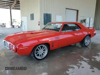 1969 Pontiac Firebird z VIN 223379ULL6573, wystawiony jako Copart lot #57812295 z przebiegiem 142 mil mil oraz Tytuł czysty. Historia ofert i sprzedaży dostępna na DreamBid. Obrazek 1.