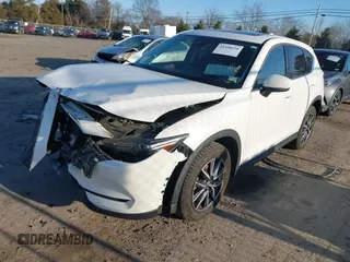 2018 Mazda CX-5 S Premium with VIN JM3KFBDM8J1419006, listed as a IAAI auction lot 41498658 with 123,622 mi miles and . Bid and sale history available at DreamBid. Image 2.