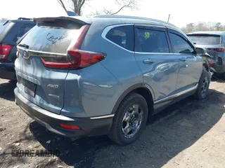 2020 Honda CR-V Touring with VIN 2HKRW2H95LH609144, listed as a IAAI auction lot 41982411 with 36,374 mi miles and . Bid and sale history available at DreamBid. Image 4.