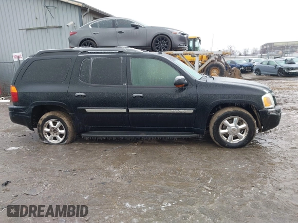 2005 GMC Envoy XL SLE with VIN 1GKET16S156160473, listed as a IAAI auction lot 41510661 with 233,942 mi miles. Bid and sale history available at carsss.com. Image 13.