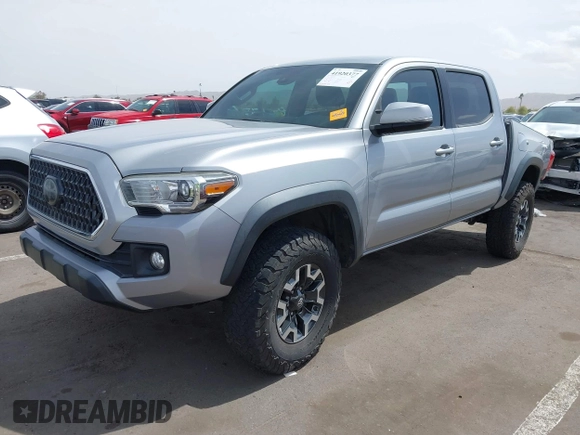 2018 Toyota Tacoma SR5 with VIN 3TMAZ5CN0JM053861, listed as a IAAI auction lot 41920377 with 104,015 mi miles and . Bid and sale history available at DreamBid. Image 2.