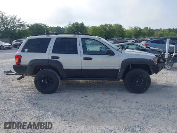 2003 Jeep Grand Cherokee Laredo z VIN 1J8GW48S33C519680, wystawiony jako IAAI lot #42126714 z przebiegiem 295 517 mil mil oraz . Historia ofert i sprzedaży dostępna na DreamBid. Obrazek 13.