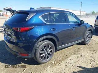 2018 Mazda CX-5 Grand Touring with VIN JM3KFADM1J0322049, listed as a IAAI auction lot 41891079 with 174,939 mi miles and . Bid and sale history available at DreamBid. Image 4.
