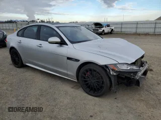 2016 Jaguar XF with VIN SAJBL4BV6GCY16964, listed as a Copart auction lot 82786584 with 100,587 mi miles and Salvage Title. Bid and sale history available at DreamBid. Image 4.