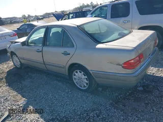 1997 Mercedes-Benz E-Class with VIN WDBJF55F4VA405680, listed as a IAAI auction lot 41462478 with 352,480 mi miles. Bid and sale history available at carsss.com. Image 3.