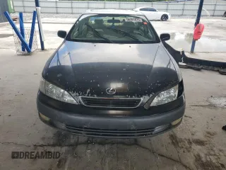 1998 Lexus ES 300 z VIN JT8BF28G7W5048920, wystawiony jako Copart lot #56391015 z przebiegiem 234 109 mil mil oraz Nie do naprawy • Non repairable. Historia ofert i sprzedaży dostępna na DreamBid. Obrazek 5.