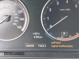 2013 BMW 5 Series 528i xDrive with VIN WBAXH5C5XDD106981, listed as a IAAI auction lot 42012477 with 140,259 mi miles. Bid and sale history available at carsss.com. Image 7.