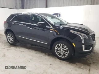 2023 Cadillac XT5 FWD Premium Luxury with VIN 1GYKNCRS6PZ171335, listed as a Copart auction lot 51859385 with 52,691 mi miles and Clean Title. Bid and sale history available at carsss.com. Image 4.