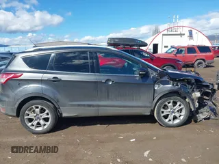 2016 Ford Escape Titanium with VIN 1FMCU9J96GUB96009, listed as a IAAI auction lot 41866127 with 132,990 mi miles and . Bid and sale history available at DreamBid. Image 14.