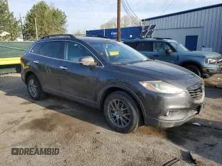 2015 Mazda CX-9 Grand Touring with VIN JM3TB3DV2F0453812, listed as a Copart auction lot 54445115 with 176,067 mi miles and Salvage title. Bid and sale history available at DreamBid. Image 4.