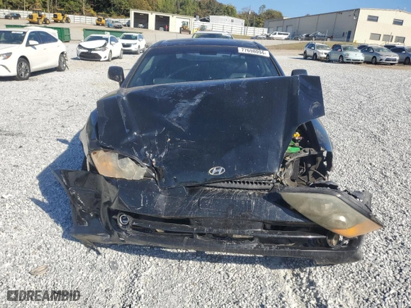 2003 Hyundai Tiburon GT with VIN KMHHN65F33U072954, listed as a Copart auction lot 77698094 with 235,445 mi miles and Salvage Title. Bid and sale history available at carsss.com. Image 5.