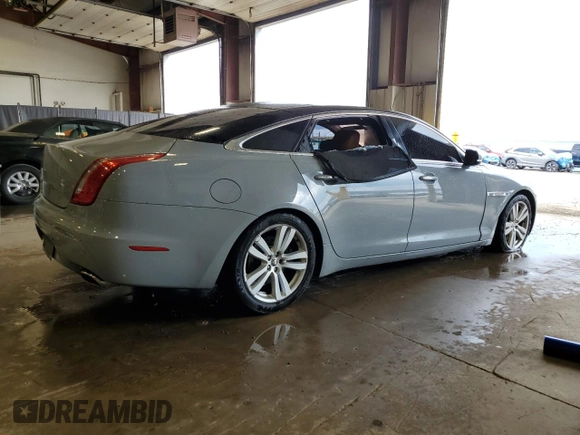 2013 Jaguar XJ with VIN SAJWJ1CD1D8V51462, listed as a Copart auction lot 50527985 with 62,995 mi miles and Salvage title. Bid and sale history available at DreamBid. Image 3.