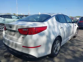 2015 Kia Optima LX with VIN KNAGM4A76F5663782, listed as a IAAI auction lot 42162942 with 128,321 mi miles. Bid and sale history available at carsss.com. Image 4.