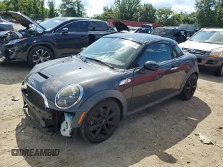 2015 MINI Coupe S z VIN WMWSX3C55FT409449, wystawiony jako Copart lot #66574174 z przebiegiem 99 155 mil mil oraz Szkody całkowita. Historia ofert i sprzedaży dostępna na DreamBid. Obrazek 1.