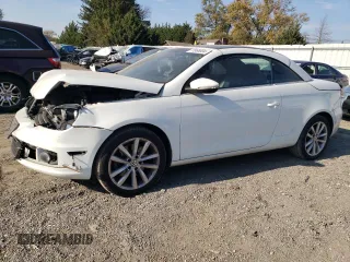 2015 Volkswagen Eos Komfort with VIN WVWBW8AH1FV000692, listed as a Copart auction lot 77866694 with 114,156 mi miles and Salvage Title. Bid and sale history available at DreamBid. Image 1.