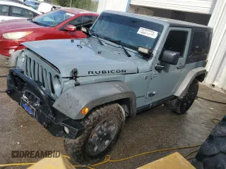 2014 Jeep Wrangler Rubicon with VIN 1C4BJWCG9EL147277, listed as a Copart auction lot 76027374 with 145,947 mi miles and Salvage title. Bid and sale history available at DreamBid. Image 1.