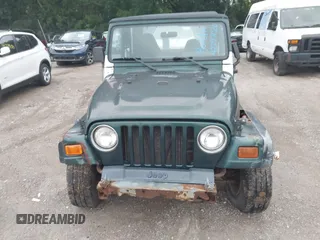 1999 Jeep Wrangler SE z VIN 1J4FY29P7XP479351, wystawiony jako IAAI lot #42797020 z przebiegiem 171 598 mil mil oraz . Historia ofert i sprzedaży dostępna na DreamBid. Obrazek 6.