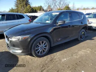 2019 Mazda CX-5 Grand Touring with VIN JM3KFBDM0K0571806, listed as a Copart auction lot 43395105 with 57,768 mi miles and Salvage Title. Bid and sale history available at carsss.com. Image 1.