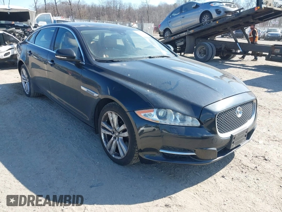 2013 Jaguar XJ Portfolio with VIN SAJWJ2GDXD8V55879, listed as a IAAI auction lot 41568366 with 121,119 mi miles and . Bid and sale history available at DreamBid. Image 1.
